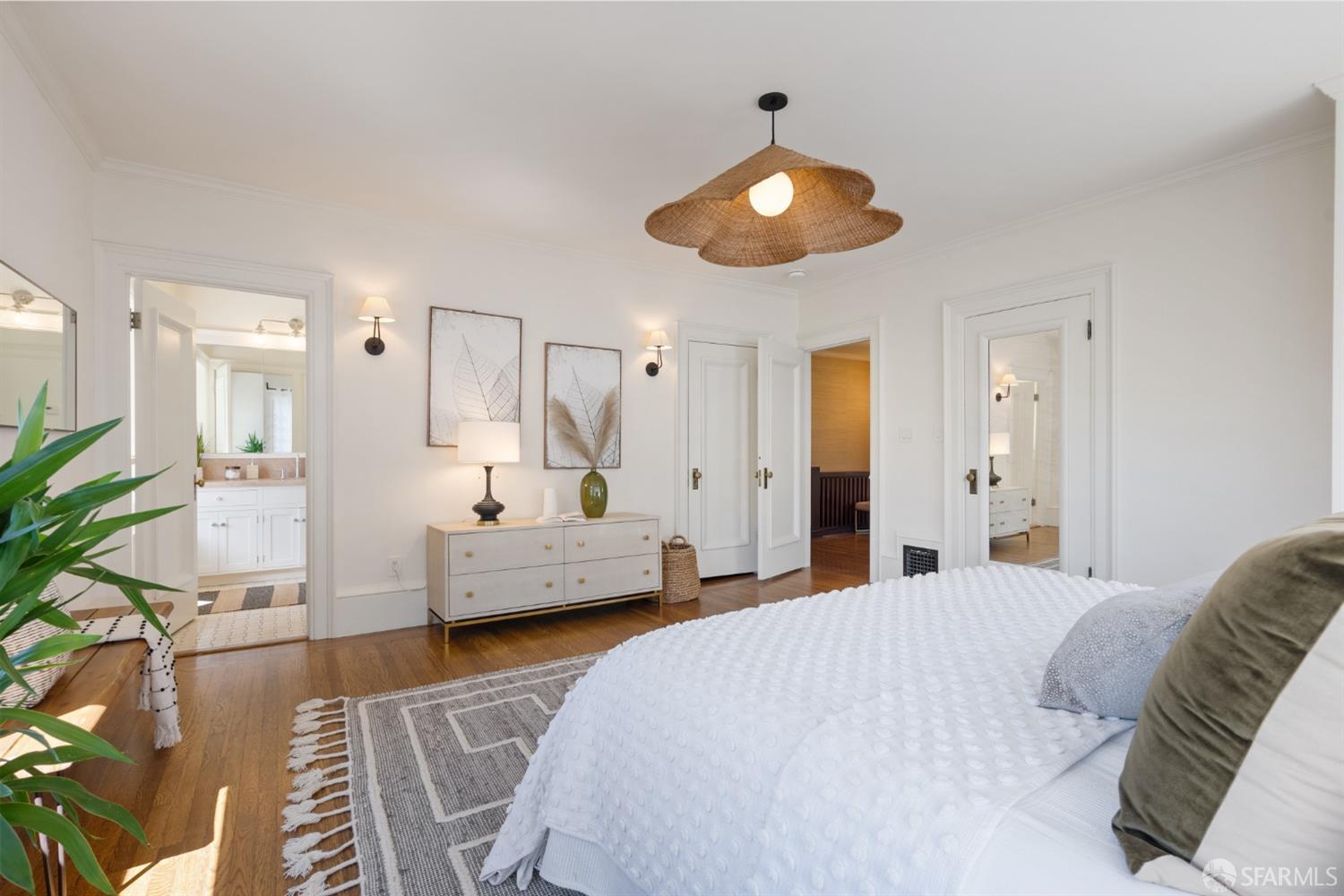 2728 Claremont Boulevard Berkeley, CA 94705 - Photo 31 of 55 a large bedroom with a bed and a chandelier