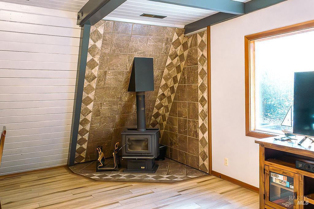 46151 Pacific Woods Road Gualala, CA 95445 - Photo 11 of 25 a view of water heater room with wooden floor