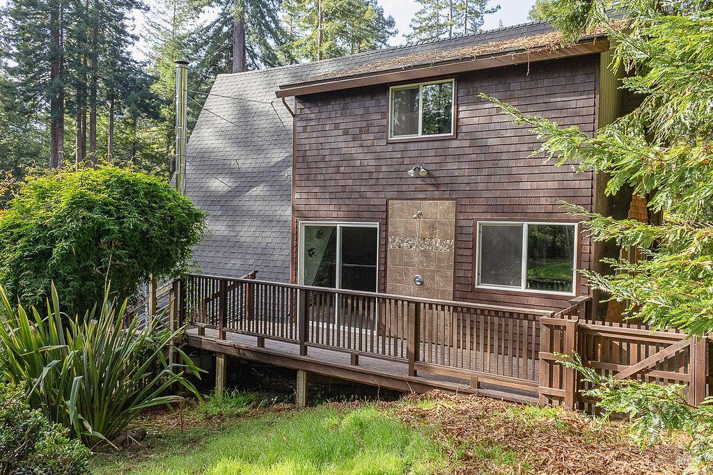 46151 Pacific Woods Road Gualala, CA 95445 - Photo 21 of 25 a front view of a house with a yard