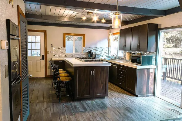a kitchen with a sink stove and cabinets