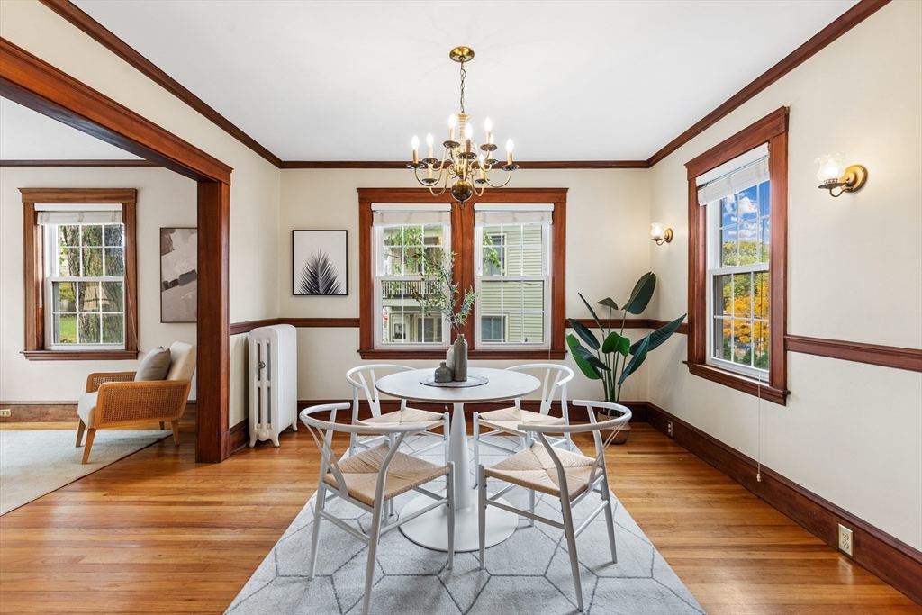 6 Appleton Place Arlington, MA 02476 - Photo 11 of 36 a dining room with furniture a chandelier and wooden floor
