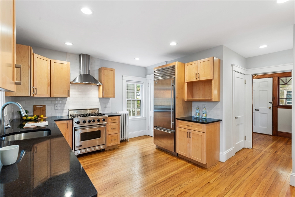 6 Appleton Place Arlington, MA 02476 - Photo 14 of 36 a kitchen with stainless steel appliances granite countertop a stove and a refrigerator