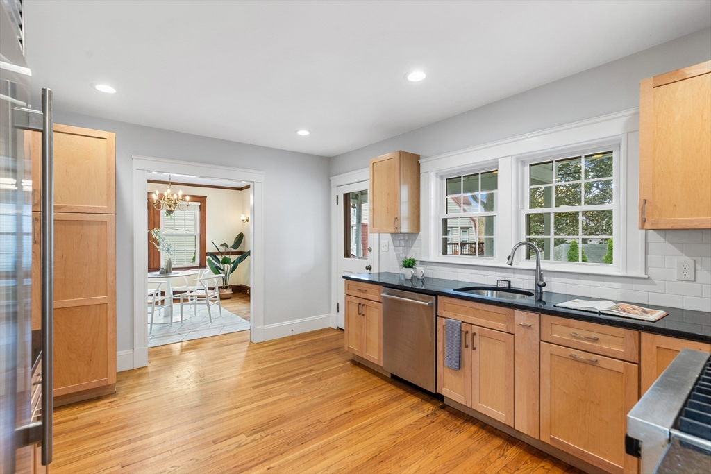 6 Appleton Place Arlington, MA 02476 - Photo 15 of 36 a large kitchen with granite countertop a large counter top space and stainless steel appliances