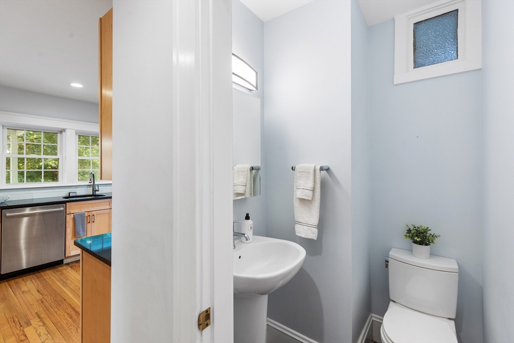 6 Appleton Place Arlington, MA 02476 - Photo 16 of 36 a bathroom with a toilet a sink and a mirror
