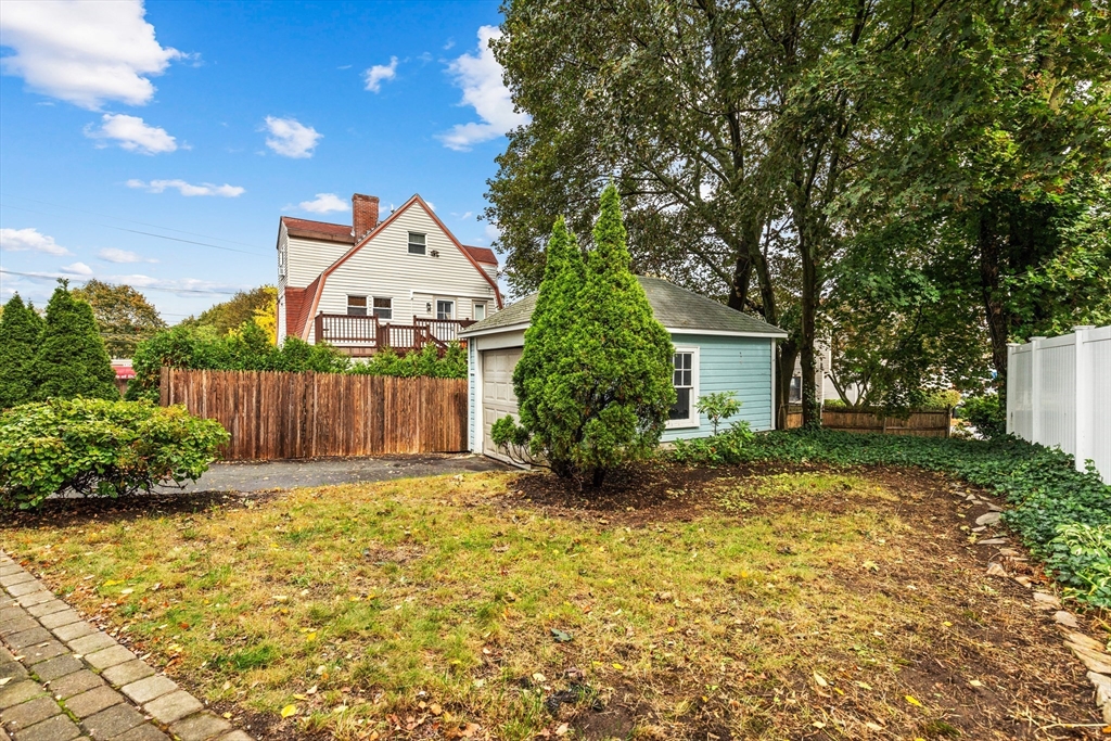 6 Appleton Place Arlington, MA 02476 - Photo 31 of 36 a view of a house with a small yard and large tree