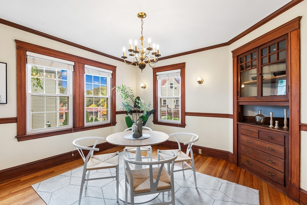 6 Appleton Place Arlington, MA 02476 - Photo 10 of 36 a dining room with furniture a chandelier and wooden floor