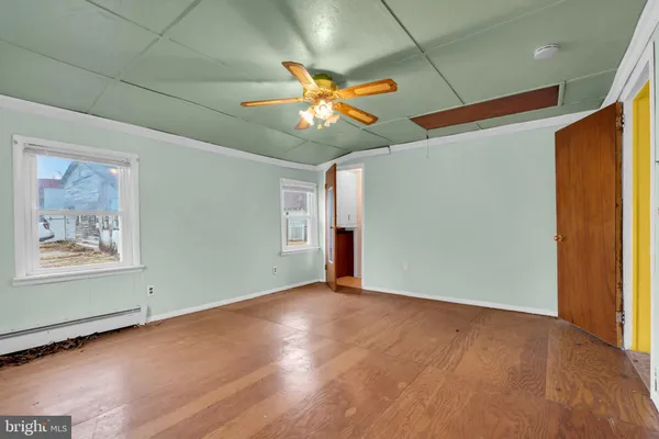 an empty room with closet and window