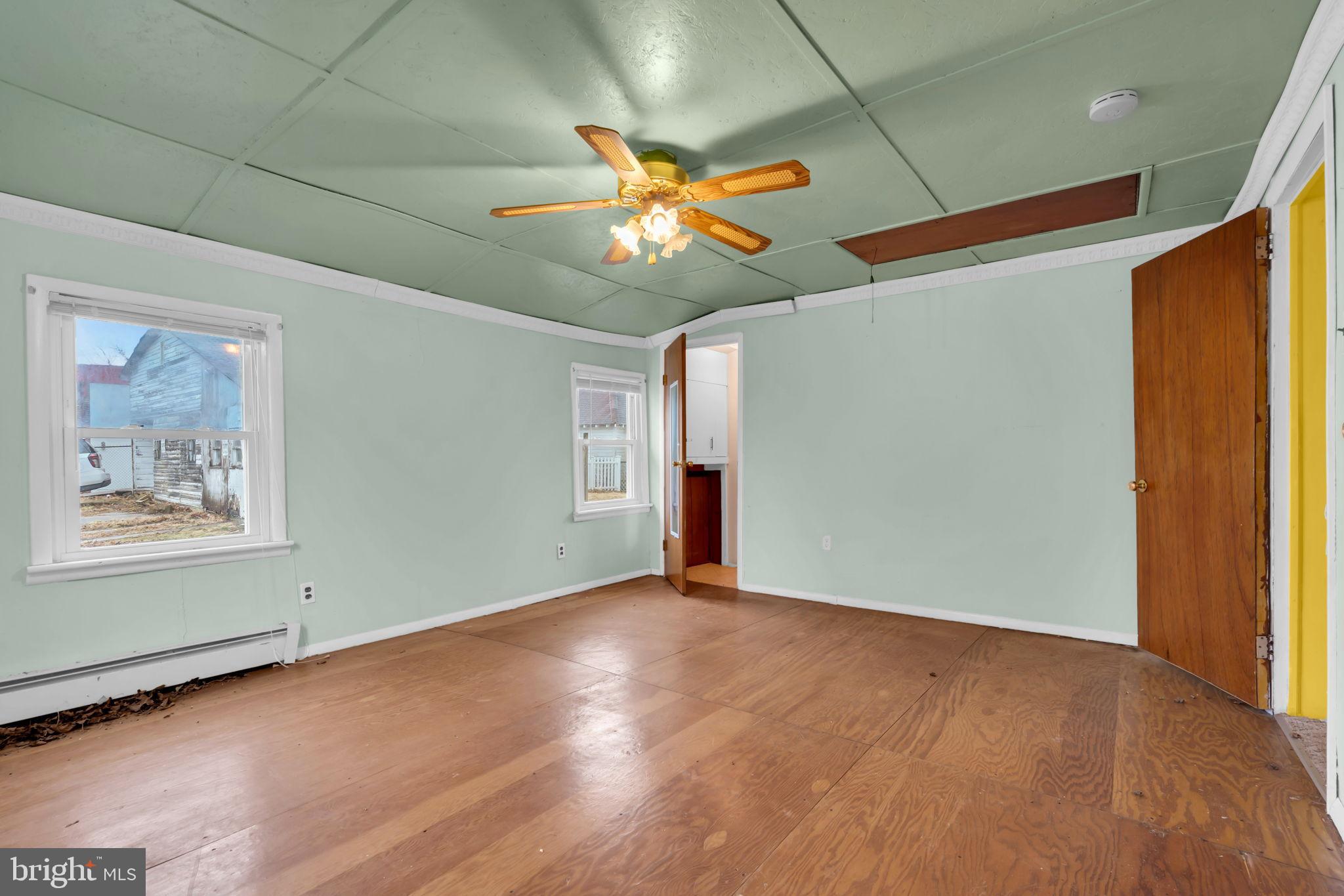 104 Maple Street Clayton, NJ 08312 - Photo 7 of 13 an empty room with closet and window