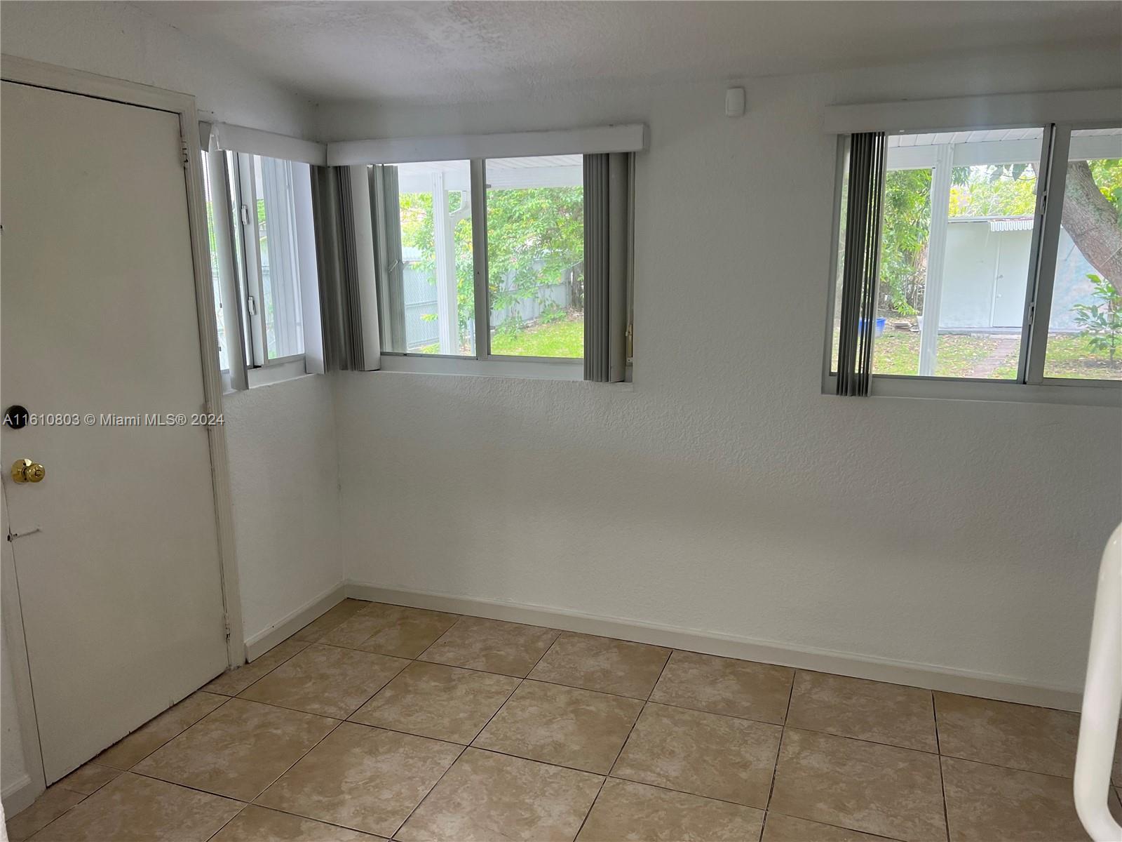 3052 Southwest 6th Street Miami, FL 33135 - Photo 12 of 17 a view of an empty room with a window