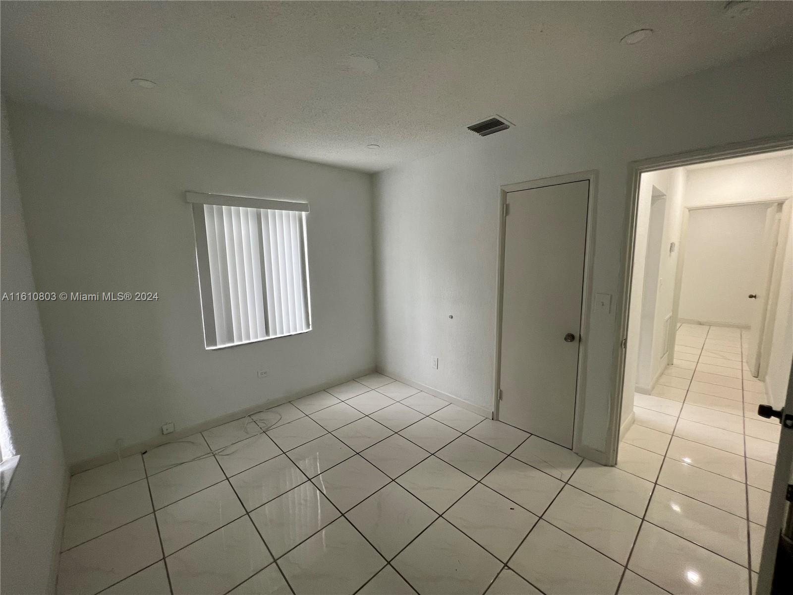 3052 Southwest 6th Street Miami, FL 33135 - Photo 14 of 17 a view of an empty room and window