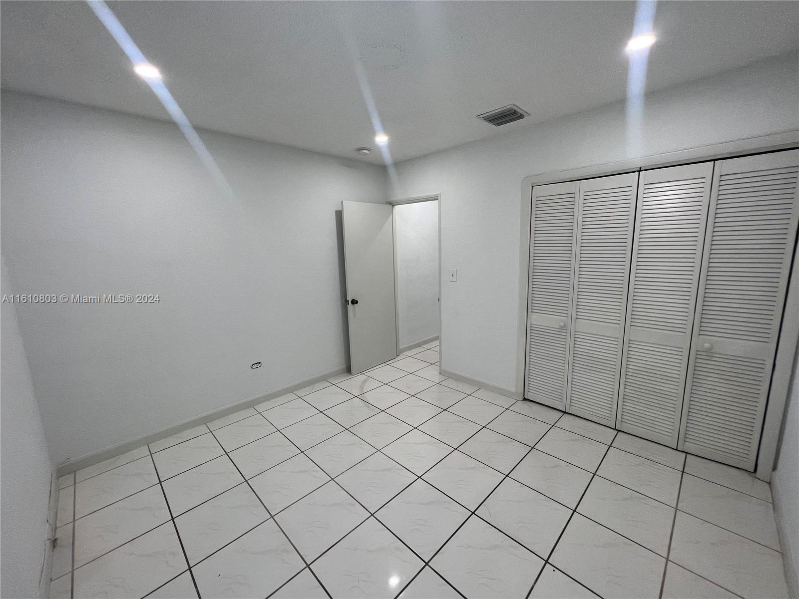 3052 Southwest 6th Street Miami, FL 33135 - Photo 15 of 17 a view of a refrigerator and window in a room