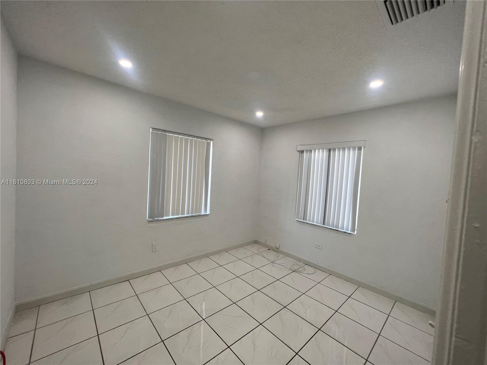 3052 Southwest 6th Street Miami, FL 33135 - Photo 4 of 17 a view of an empty room and window