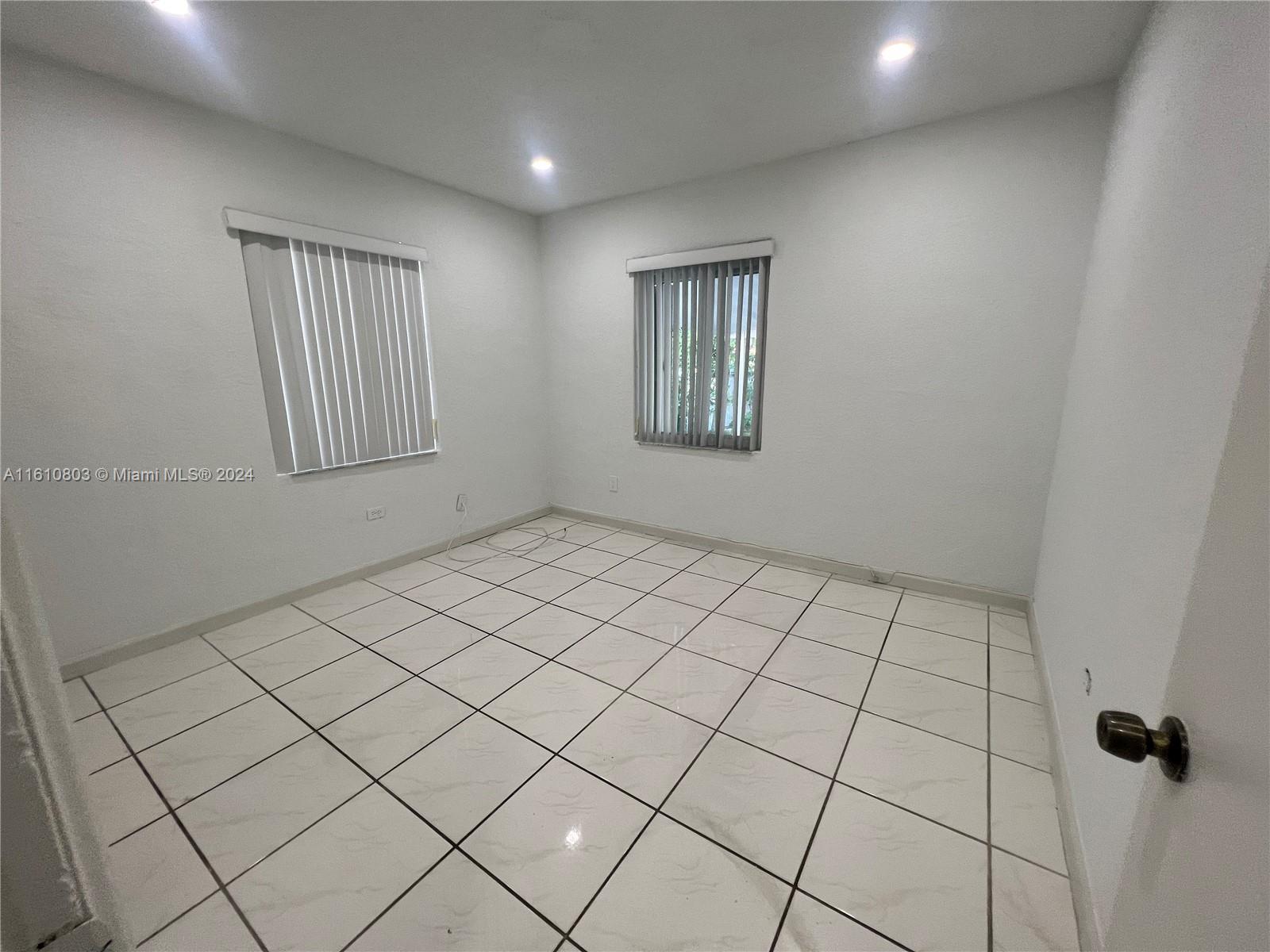 3052 Southwest 6th Street Miami, FL 33135 - Photo 7 of 17 a view of an empty room and window