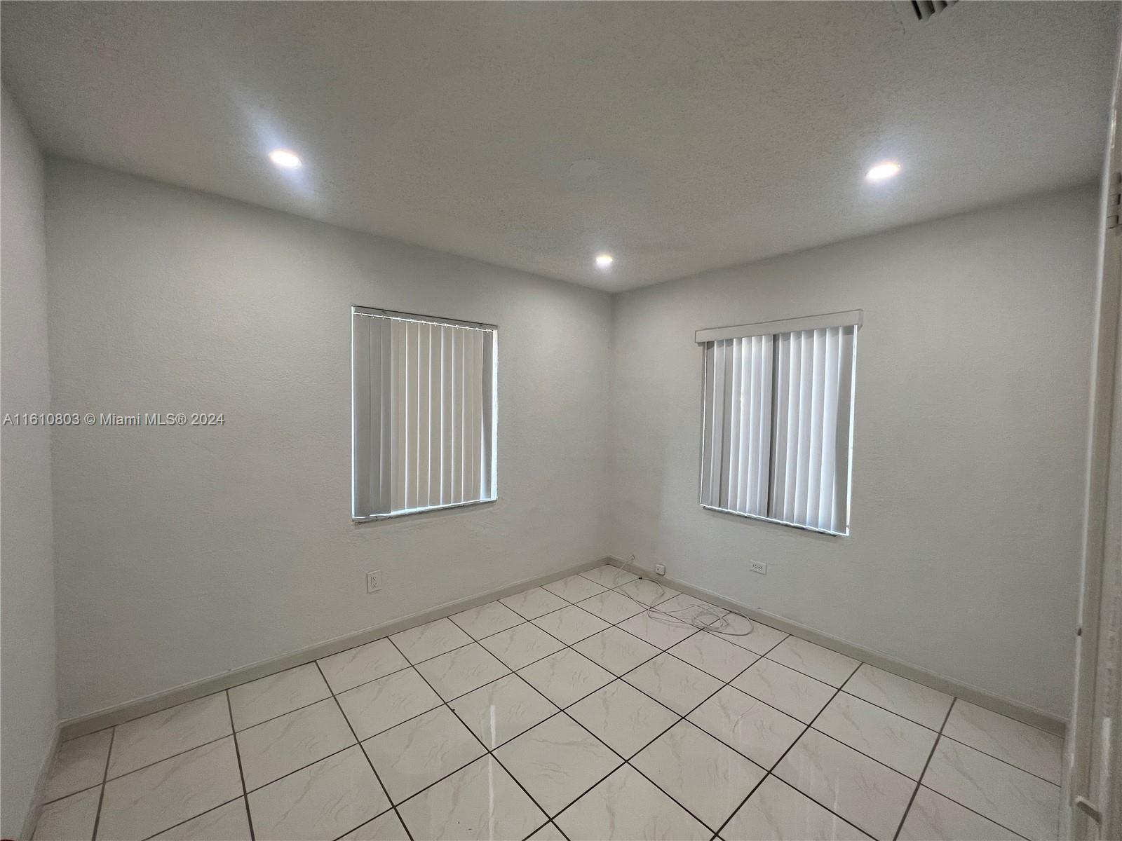 3052 Southwest 6th Street Miami, FL 33135 - Photo 9 of 17 a view of an empty room and window