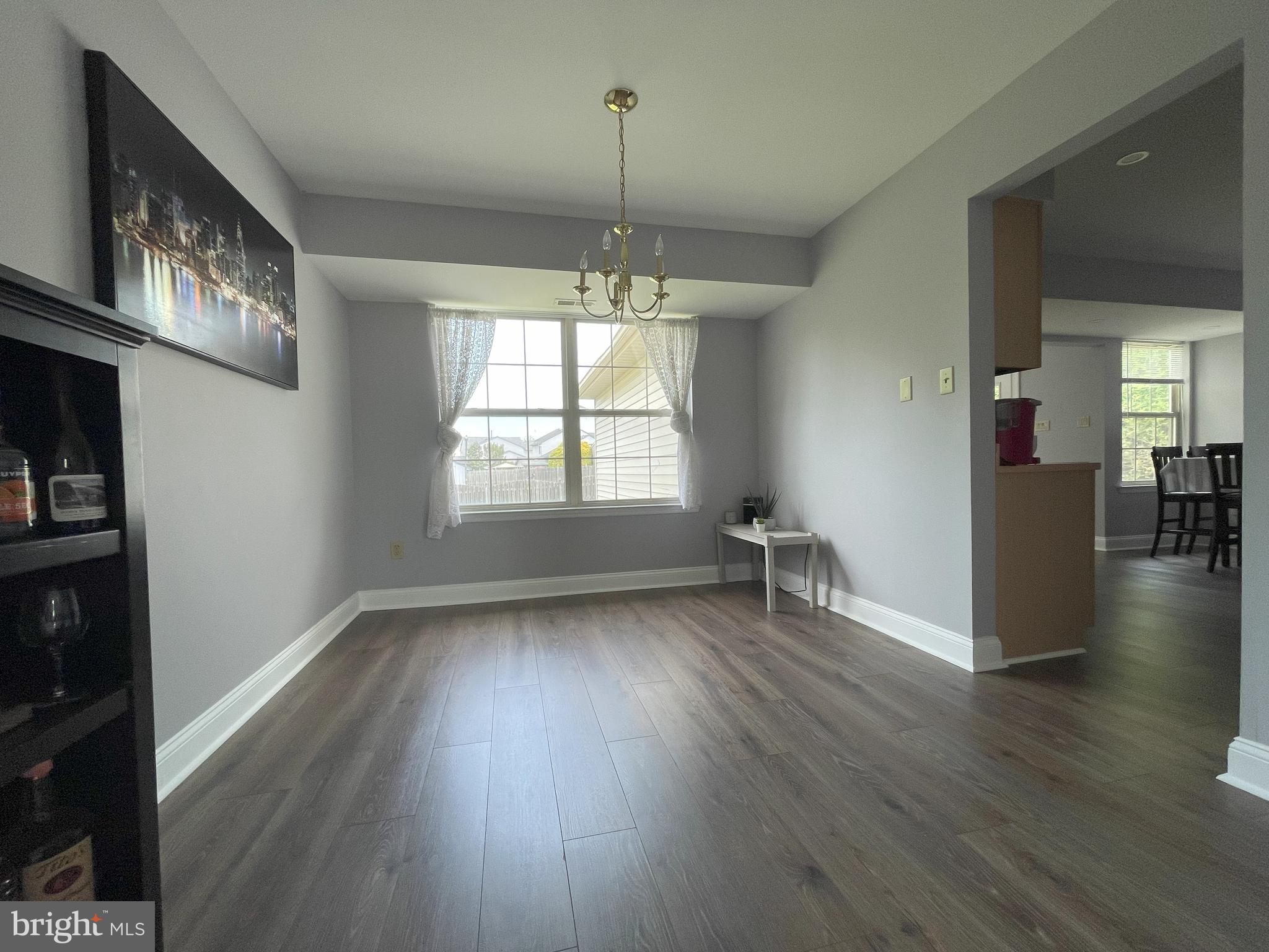 102 Springcress Drive Delran, NJ 08075 - Photo 13 of 50 a view of an empty room with window and wooden floor