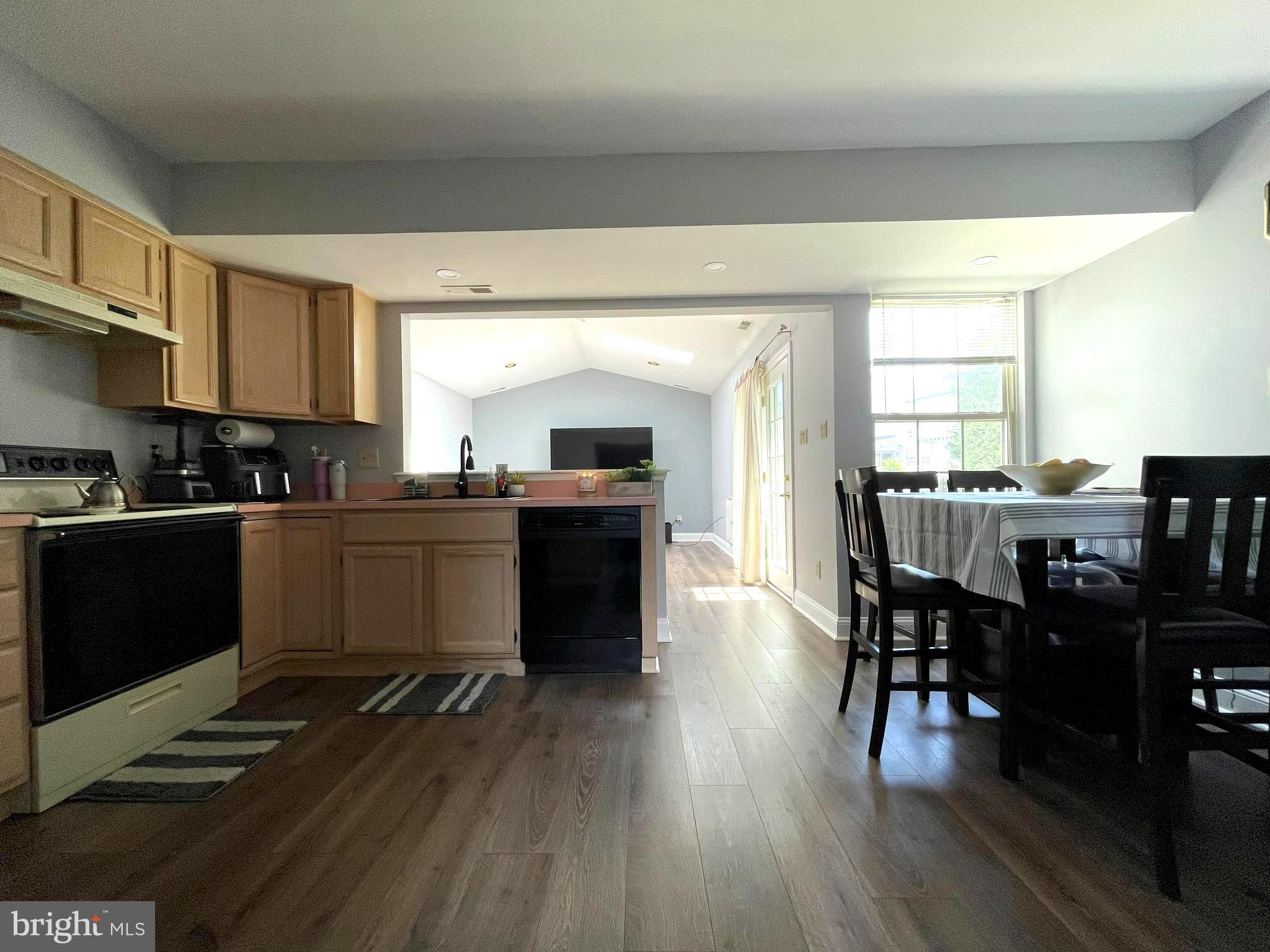 102 Springcress Drive Delran, NJ 08075 - Photo 21 of 50 a kitchen with a table chairs sink and cabinets
