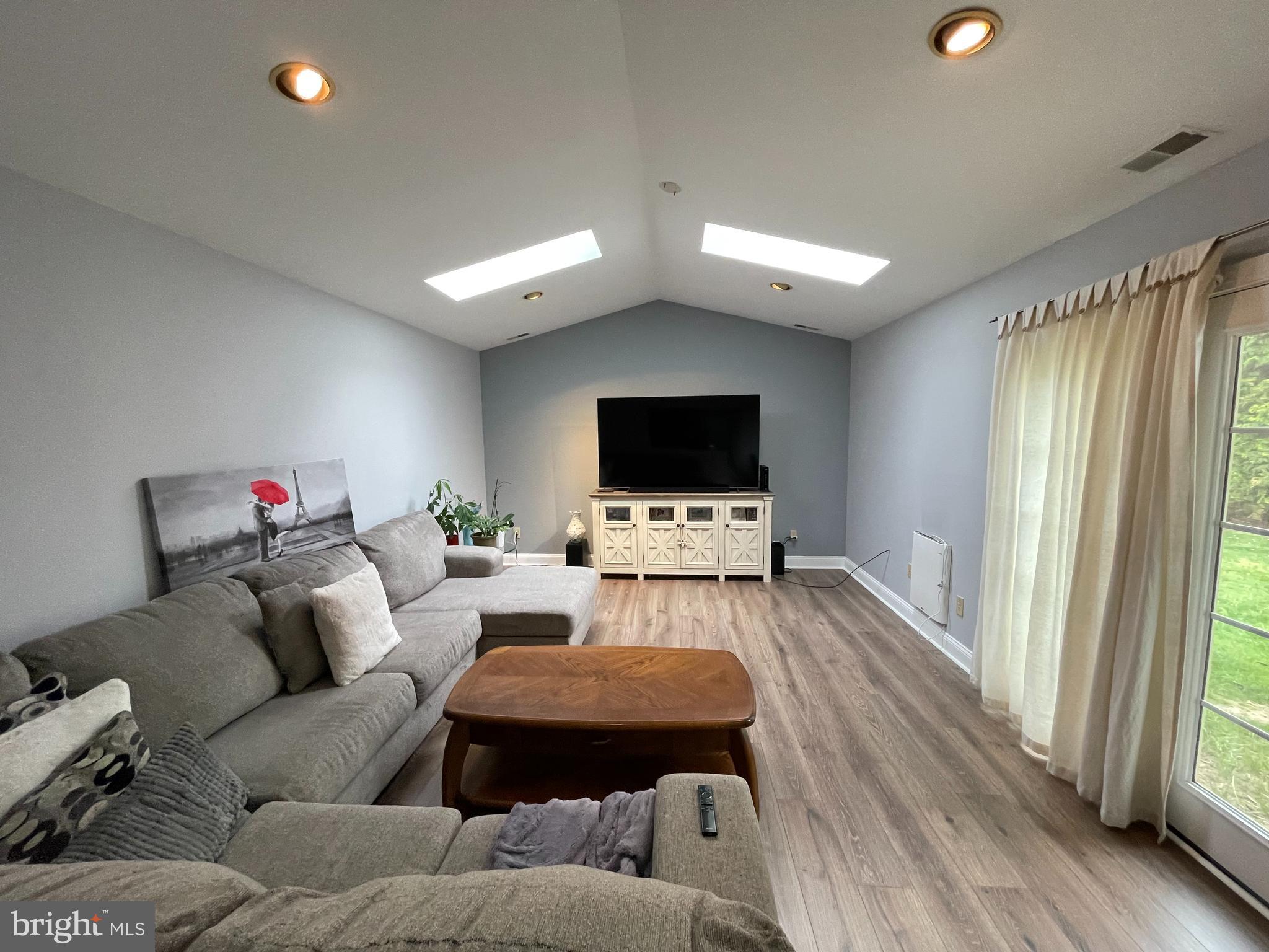 102 Springcress Drive Delran, NJ 08075 - Photo 22 of 50 a living room with furniture and a flat screen tv