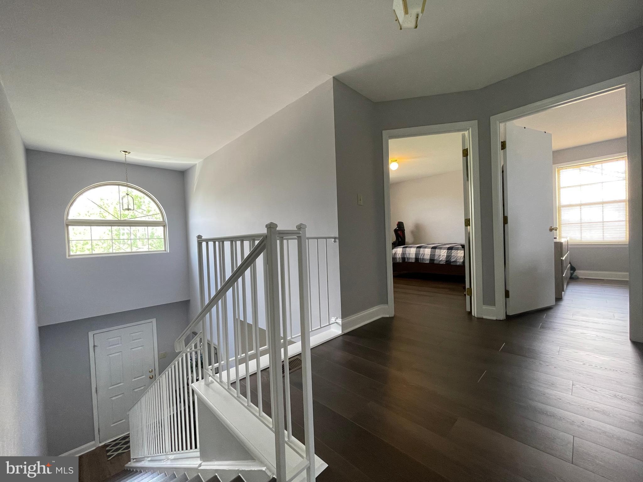 102 Springcress Drive Delran, NJ 08075 - Photo 27 of 50 a view of a livingroom with wooden floor and stairs