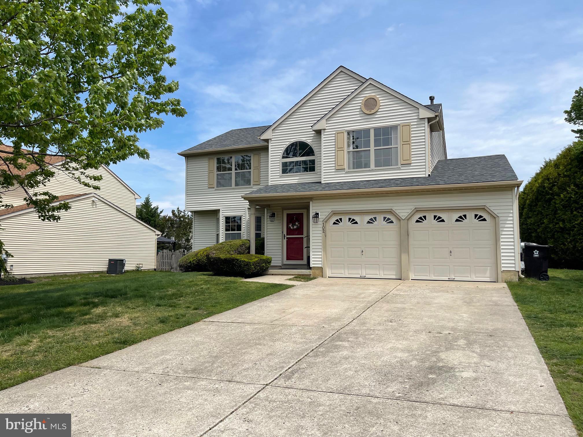 102 Springcress Drive Delran, NJ 08075 - Photo 3 of 50 a front view of a house with a garden and garage