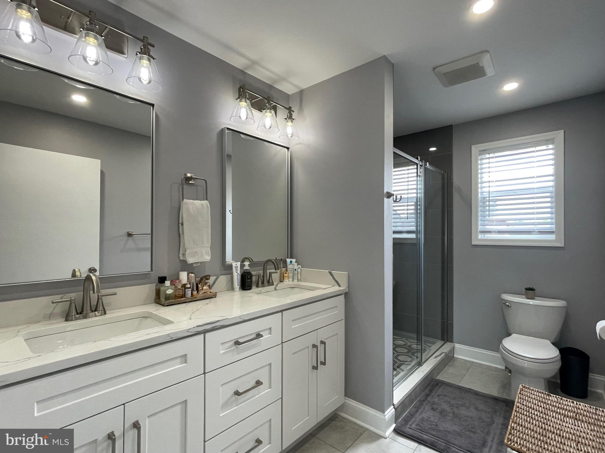 102 Springcress Drive Delran, NJ 08075 - Photo 39 of 50 a spacious bathroom with double sink a toilet a mirror and shower