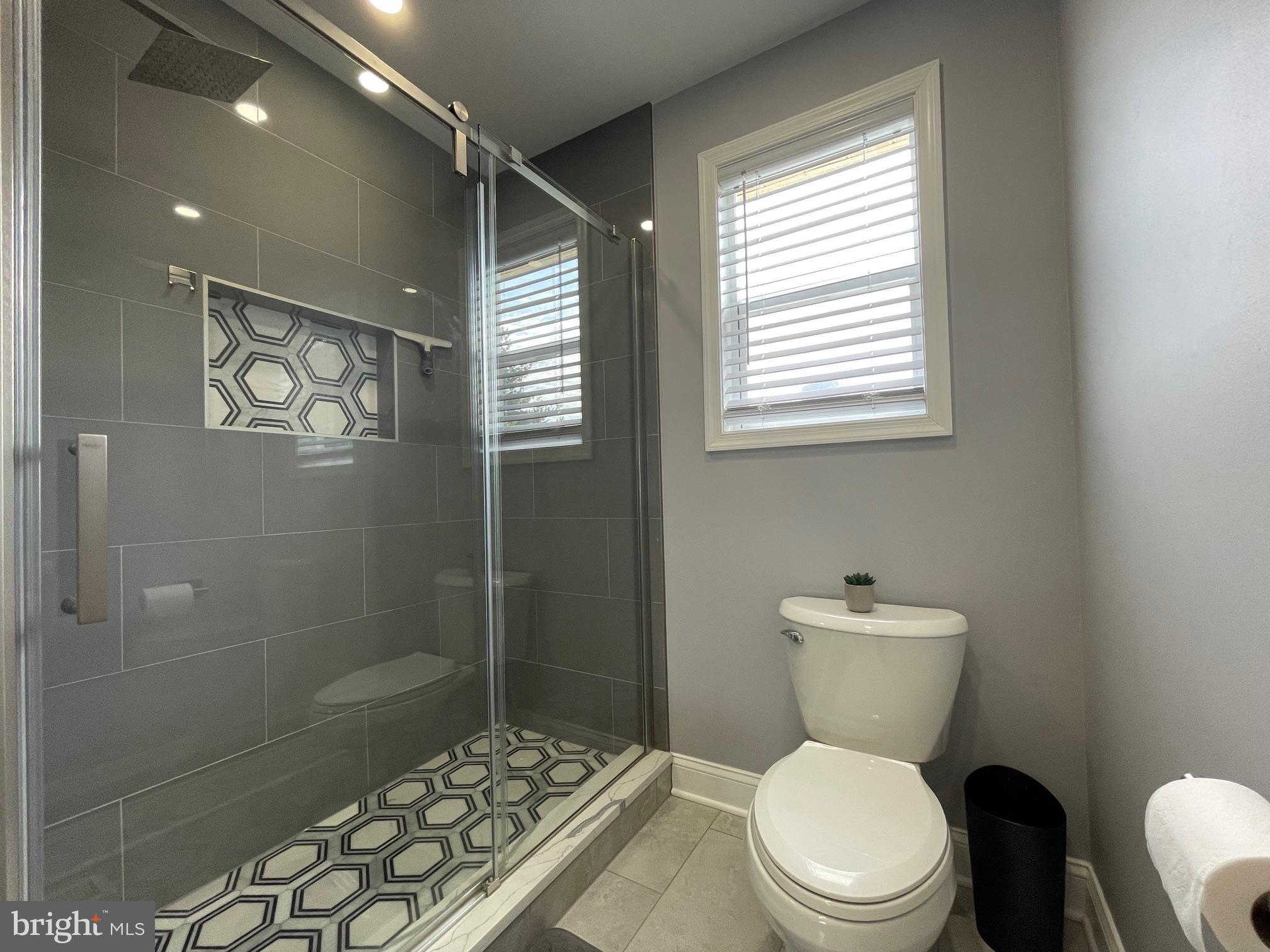 102 Springcress Drive Delran, NJ 08075 - Photo 41 of 50 a white toilet sitting next to a bathroom sink