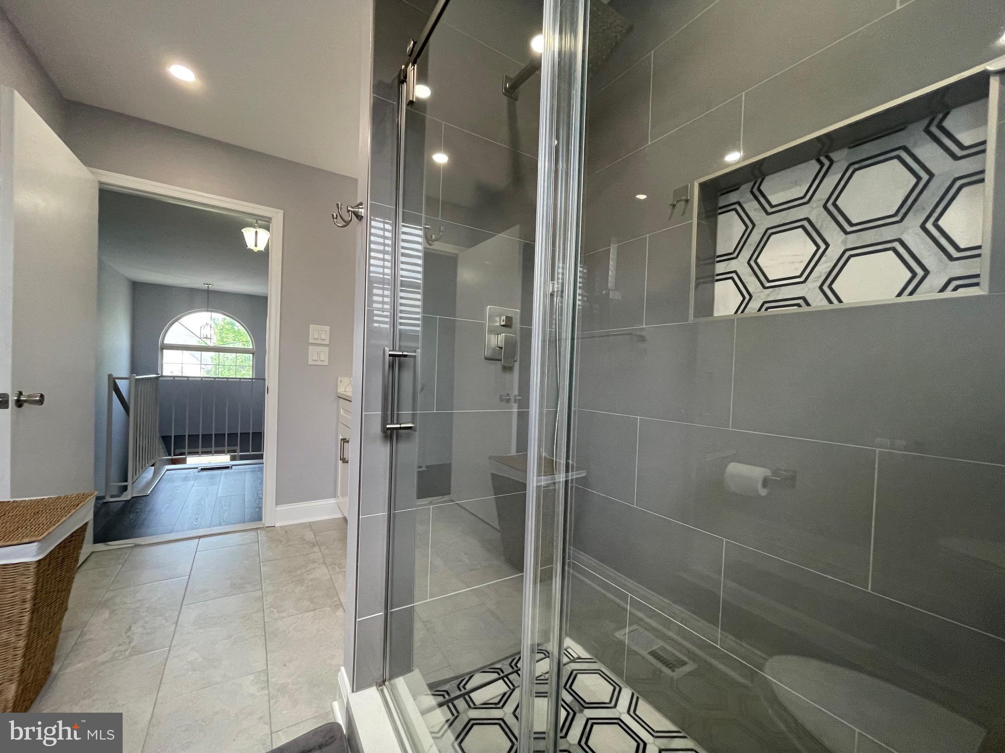 102 Springcress Drive Delran, NJ 08075 - Photo 42 of 50 a bathroom with a glass shower door and a sink