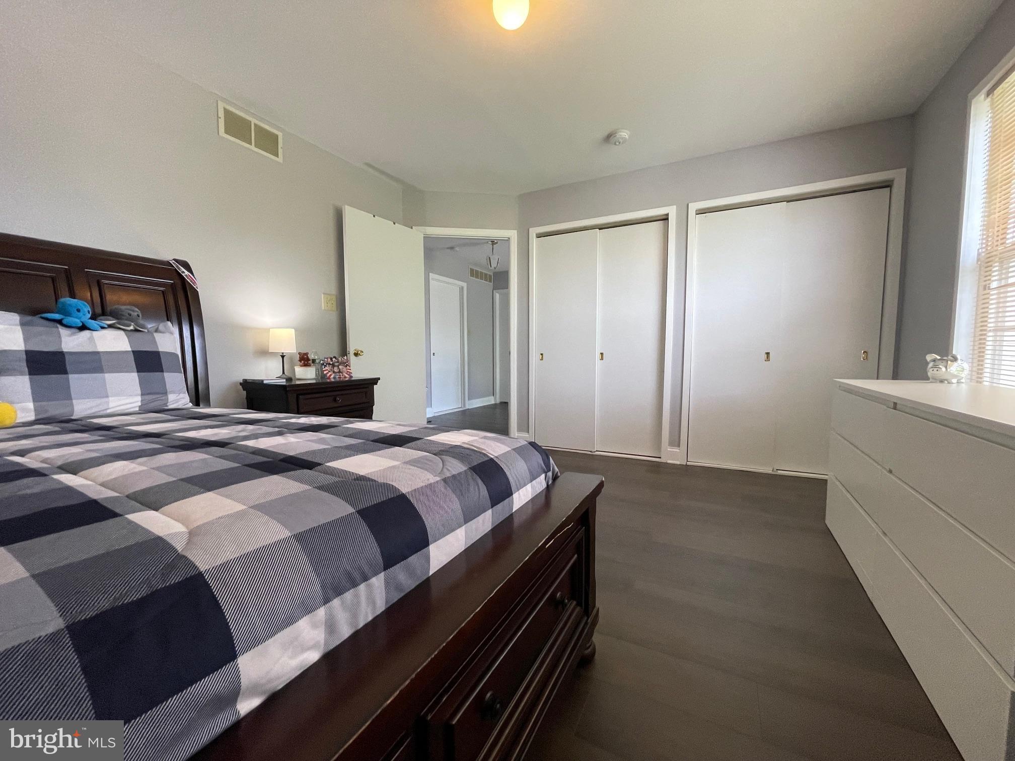 102 Springcress Drive Delran, NJ 08075 - Photo 44 of 50 a bedroom with a bed and a large mirror