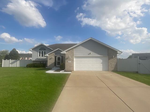 a front view of a house with yard