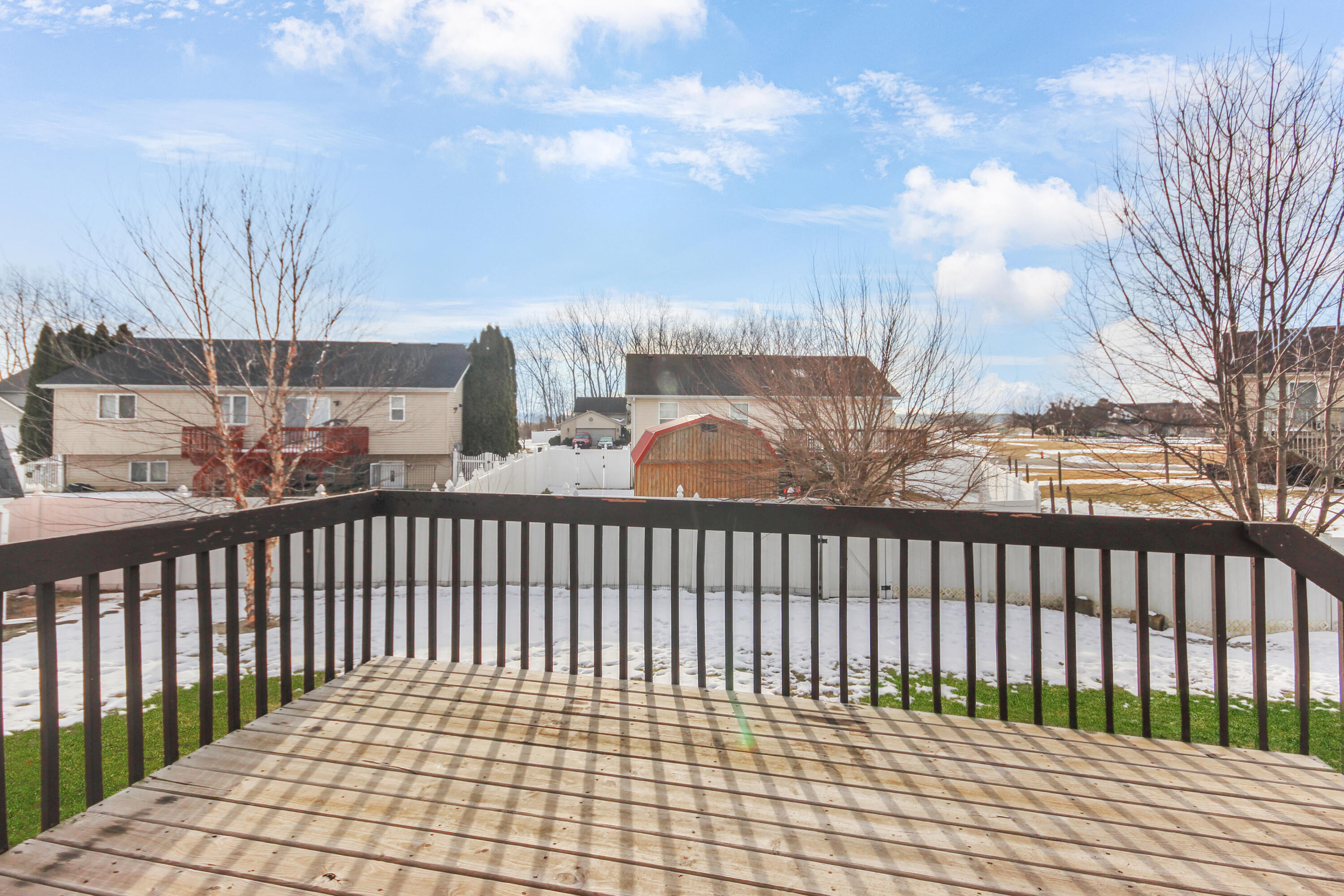1691 Ruby Court Hobart, IN 46342 - Photo 22 of 27 a view of a balcony with wooden fence