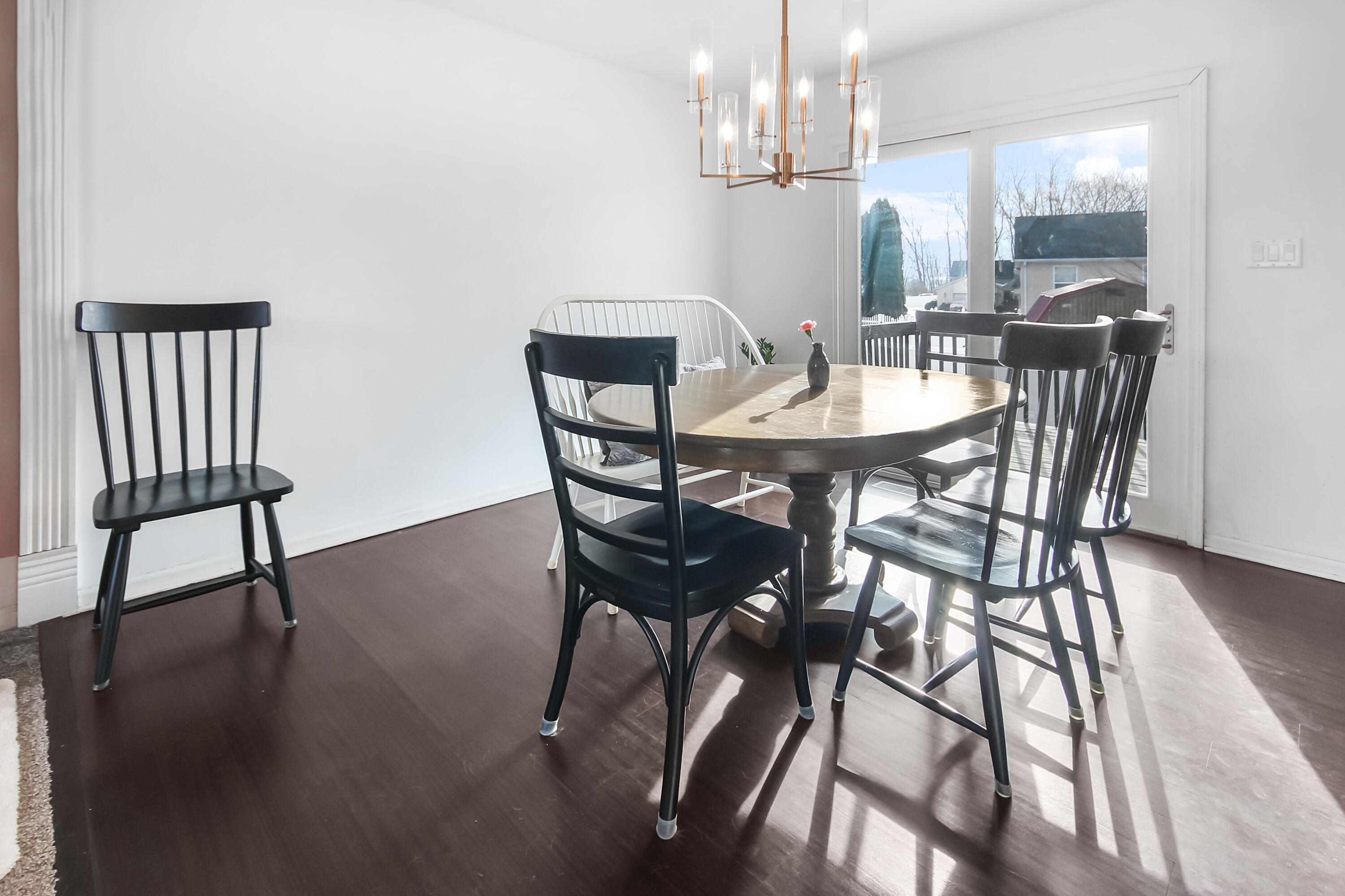1691 Ruby Court Hobart, IN 46342 - Photo 10 of 27 a view of a dining room with furniture and wooden floor