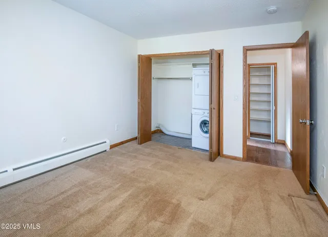 a view of empty room with closet