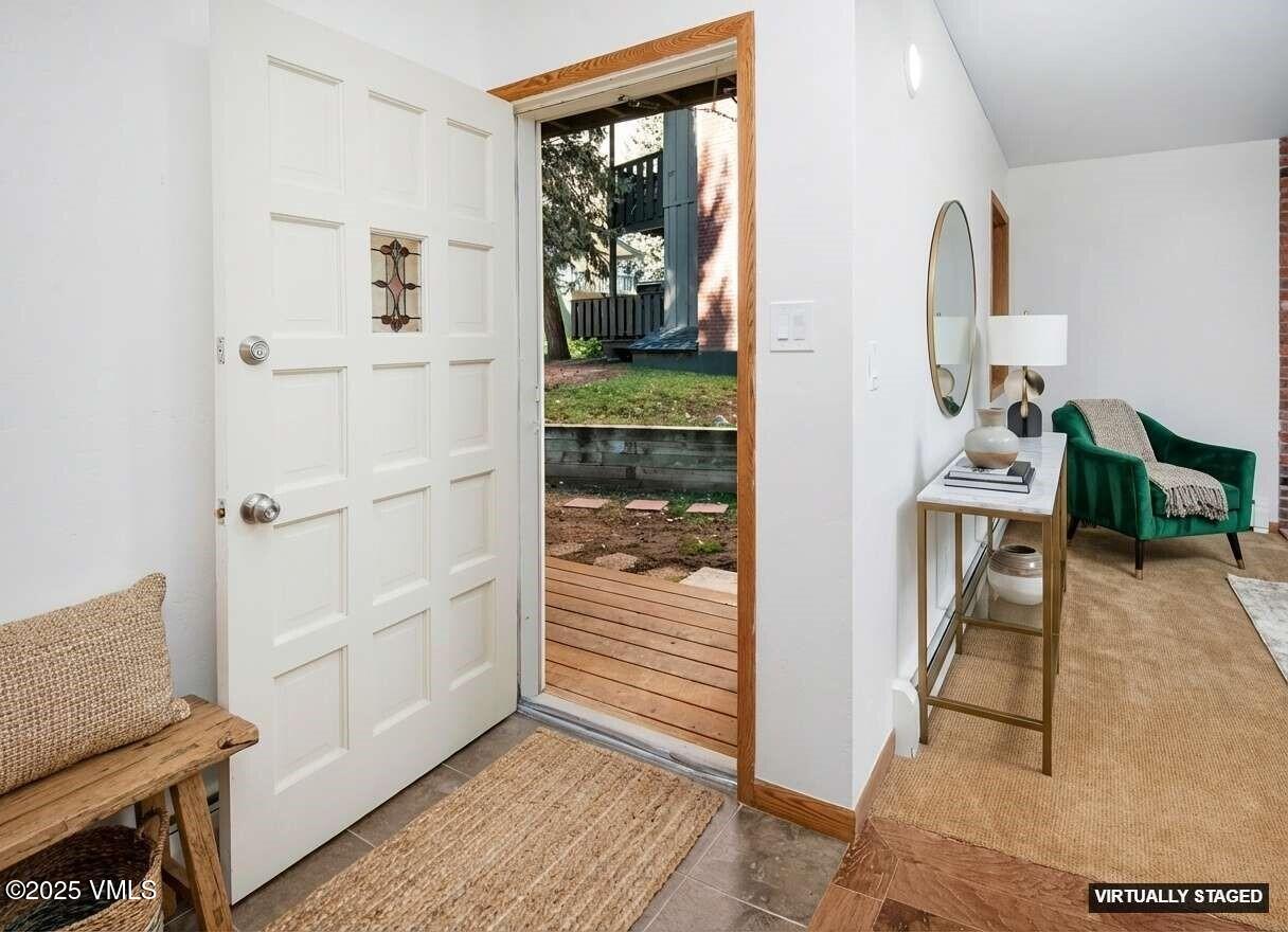 921 Red Sandstone Road, Unit A Vail, CO 81657 - Photo 14 of 26 a view of a livingroom with wooden floor and furniture