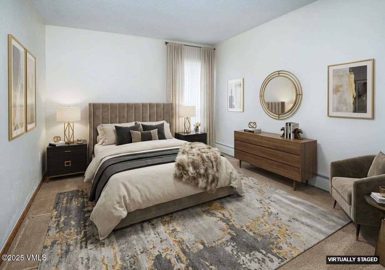 921 Red Sandstone Road, Unit A Vail, CO 81657 - Photo 17 of 26 a bedroom with bed and a window