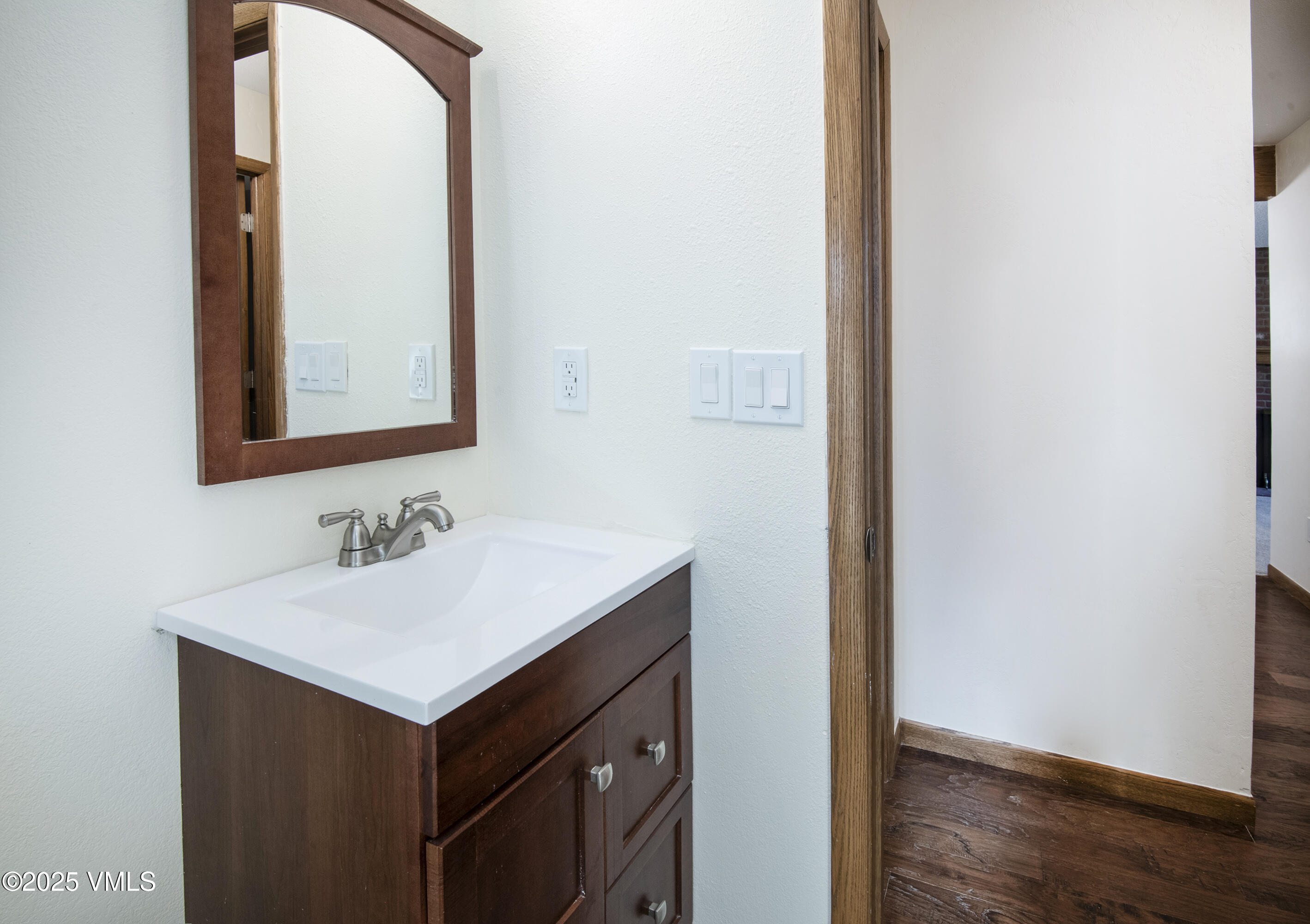 921 Red Sandstone Road, Unit A Vail, CO 81657 - Photo 22 of 26 a bathroom with a sink and a mirror