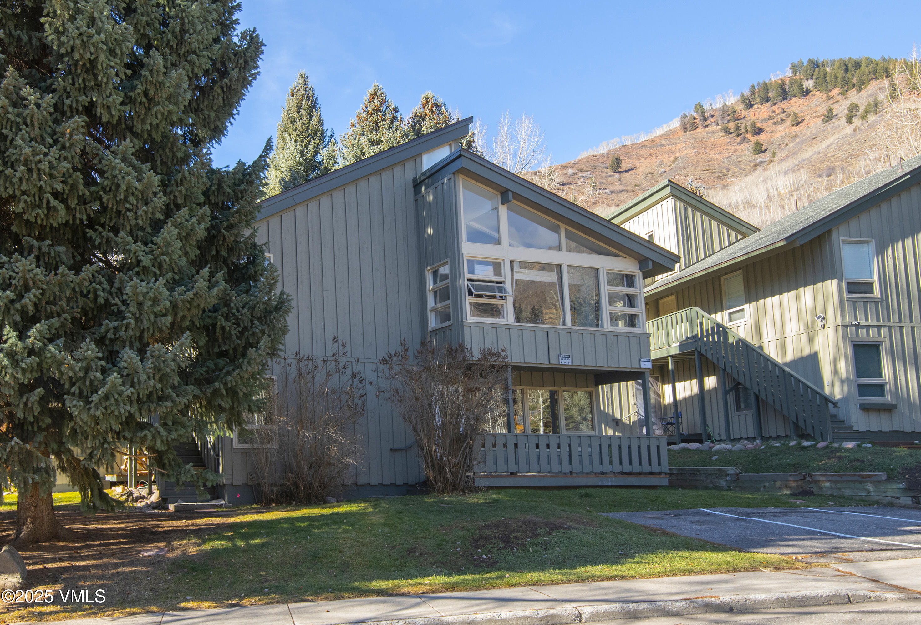 921 Red Sandstone Road, Unit A Vail, CO 81657 - Photo 26 of 26 a view of a house with a yard