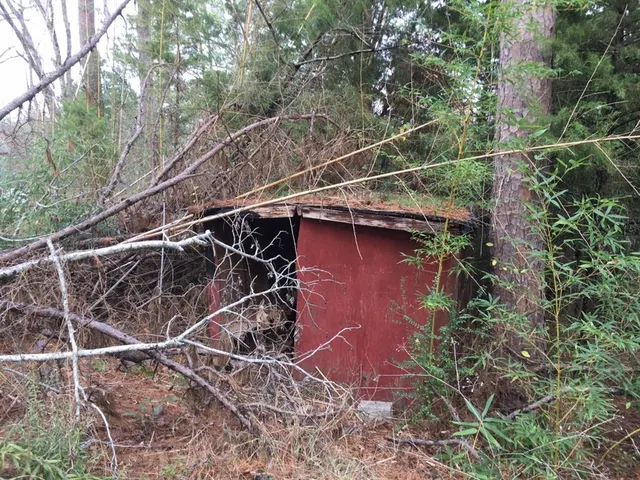 a backyard of a house with outdoor seating