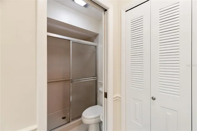 a bathroom with a sink a mirror and a shower