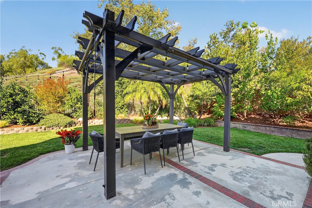 20752 Raintree Lane Rancho Santa Margarita, CA 92679 - Photo 45 of 74 So much privacy, spa, Built in BBQ, fire pit, pond and fruit trees