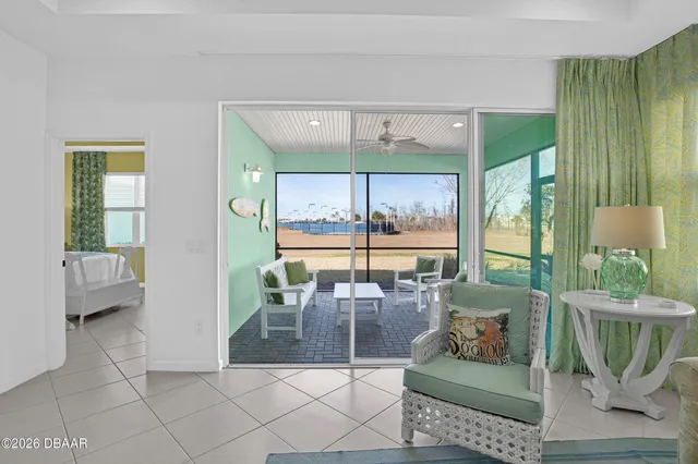 an aerial view of a city with lots of residential buildings and ocean view