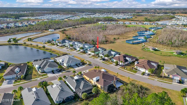 a view of a swimming pool with outdoor seating