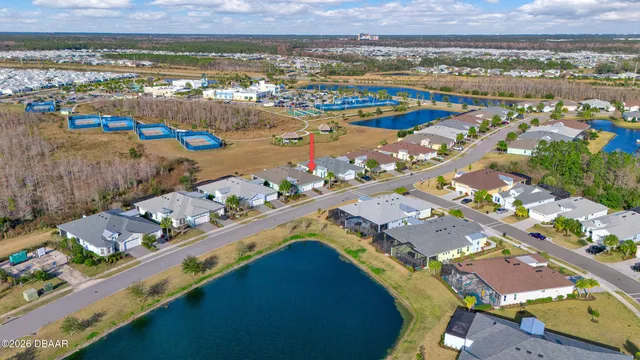 an aerial view of a pool yard and lake view