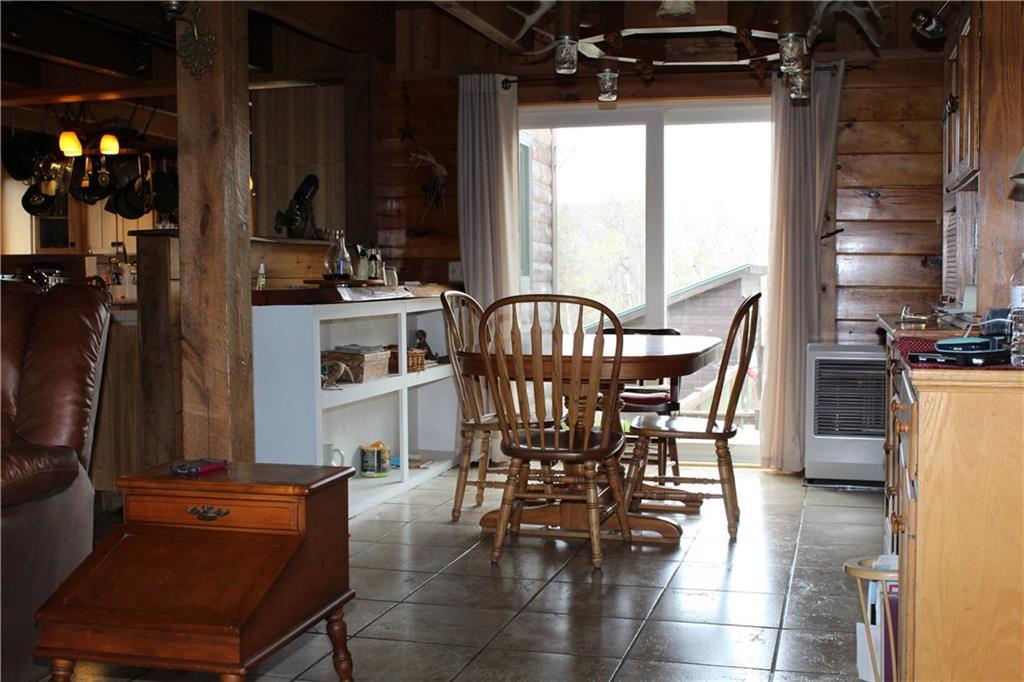 114 Donigan Road Moscow, ME 04920 - Photo 13 of 27 Large dining room with slider...