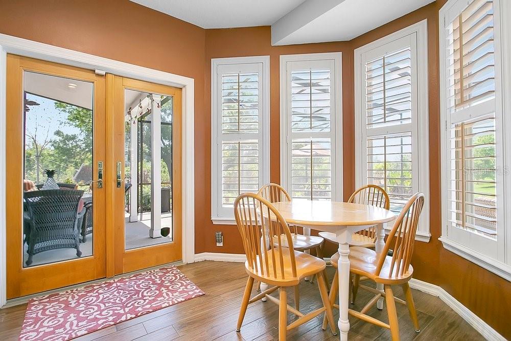 2702 Carter Grove Circle Windermere, FL 34786 - Photo 17 of 42 a view of a dining room with furniture and windows