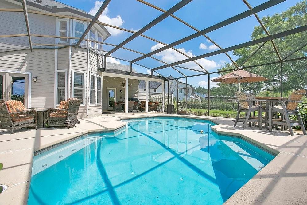 2702 Carter Grove Circle Windermere, FL 34786 - Photo 29 of 42 a view of a patio with a table and chairs