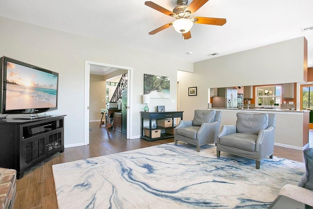 2702 Carter Grove Circle Windermere, FL 34786 - Photo 8 of 42 a living room with furniture and a flat screen tv
