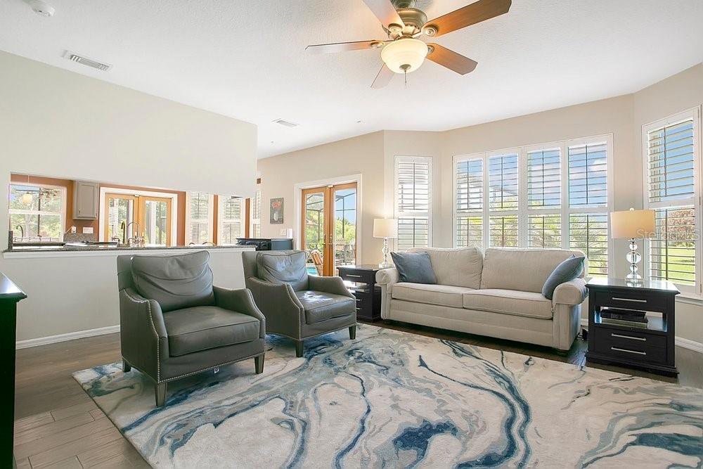 2702 Carter Grove Circle Windermere, FL 34786 - Photo 9 of 42 a living room with furniture and a large window
