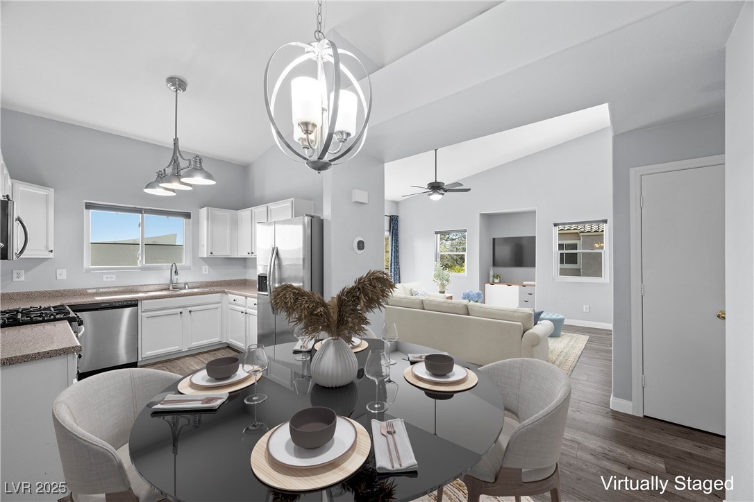 2152 Quarry Ridge Street, Unit 207 Las Vegas, NV 89117 - Photo 14 of 37 "Virtually Staged" Dining space with dark wood-type flooring, lofted ceiling, and a ceiling fan