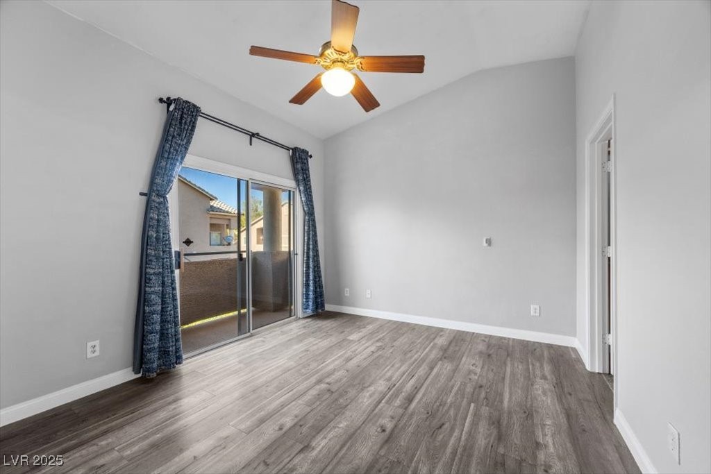 2152 Quarry Ridge Street, Unit 207 Las Vegas, NV 89117 - Photo 19 of 37 Unfurnished room featuring lofted ceiling, wood finished floors, and ceiling fan