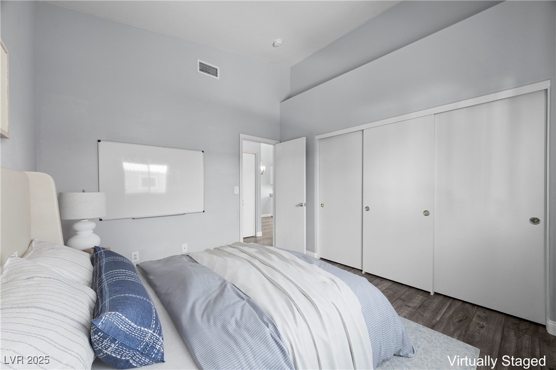2152 Quarry Ridge Street, Unit 207 Las Vegas, NV 89117 - Photo 25 of 37 "Virtually Staged" Bedroom featuring wood finished floors and a closet