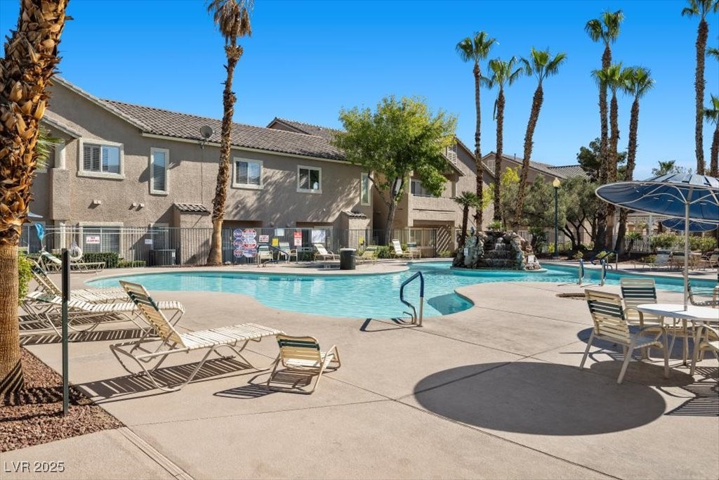 2152 Quarry Ridge Street, Unit 207 Las Vegas, NV 89117 - Photo 32 of 37 Community pool featuring a patio